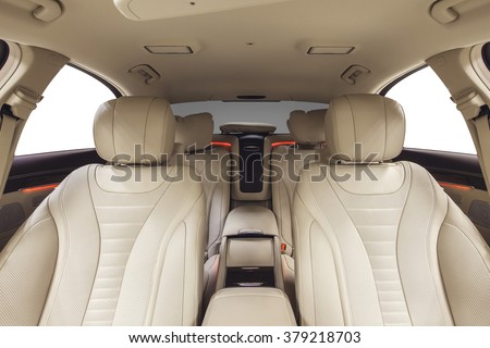 Car interior luxury seats. Interior of prestige modern car. Leather comfortable seats. Beige cockpit  on isolated white background.