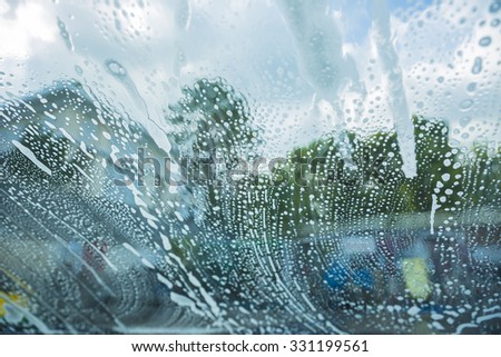 a series of photos at the car-wash, through the windshield from inside the car.