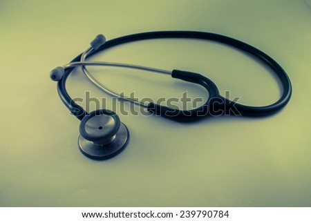 stethoscope with old vintage grunge texture representing health care and medical doctor tool for diagnosis.