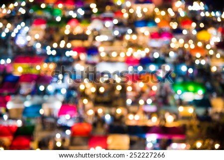 photo of night market high view  from building  colorful tent retail shop and lighting