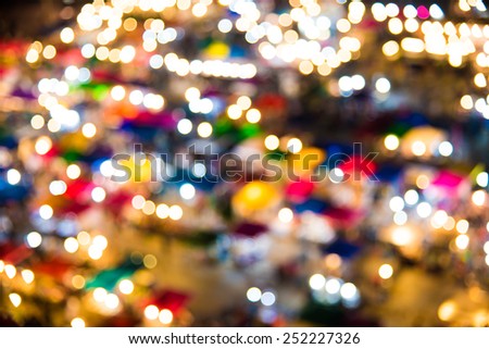 photo of night market high view  from building  colorful tent retail shop and lighting