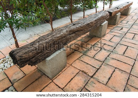 bench made of sleeper and concrete in raw style