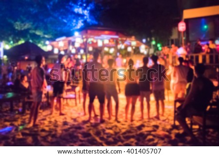 blurred background photo of many people had fun at a beach party