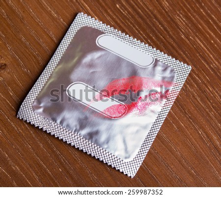 condom with red lipstick imprint