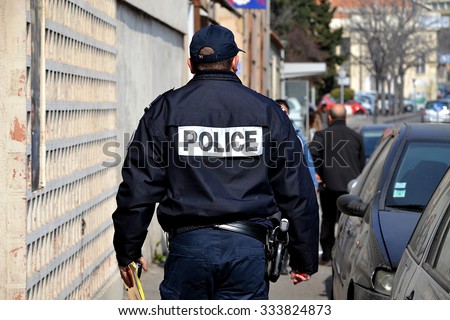 Marseille, France - March 12, 2015 : French policeman walking down the street.