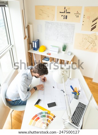 Young architect at his studio