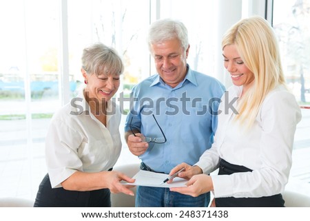 Elderly couple purchasing life insurance