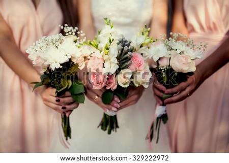 bridesmaid with flowers at the wedding