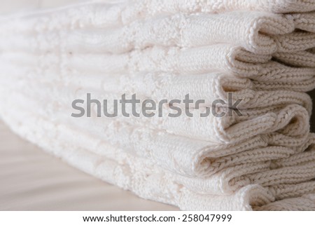 White knitted throw folded in layers