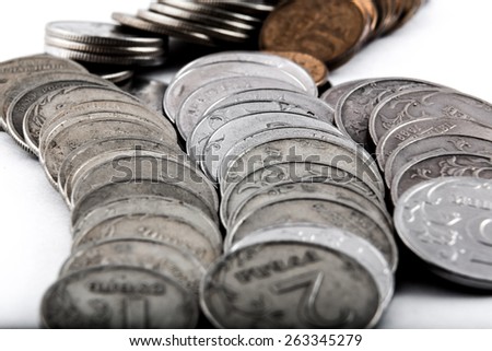 White and yellow coins lie in a big heap, on them you will buy nothing