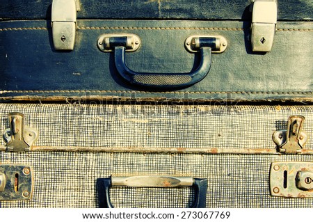 Handles of old suitcases close up. Old suitcases.