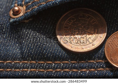 Jeans pockets with five cents euro coin
