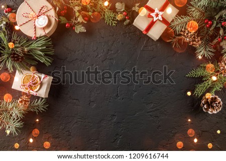Christmas gift boxes on holiday background with Fir branches, pine cones. Xmas and Happy New Year theme, bokeh, sparking, glowing. Flat lay, top view, space for text