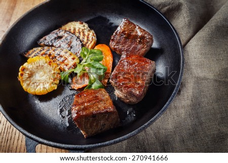 Grilled of beef with rustic vegetables on a pan