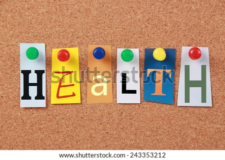 The word Health in cut out magazine letters pinned to a cork board.