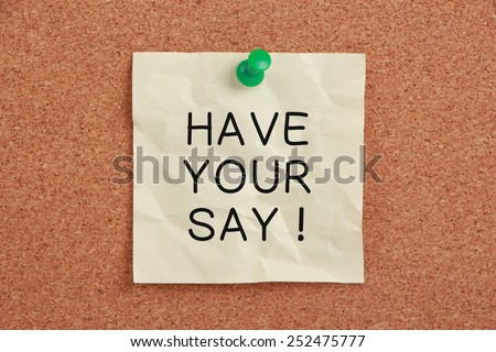 Have Your Say sticky note pinned on cork.