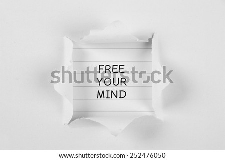 Free your mind on brown paper with white tear paper.