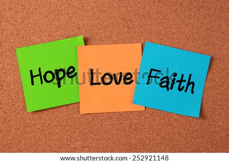 \'Hope, Love, Faith\' notes pasted on cork board.