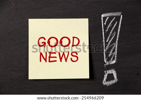 Good news note with big excal matory mark on blackboard.