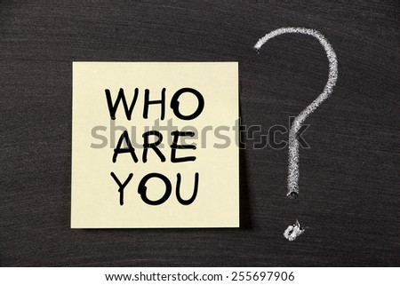 Who are you note with a big chalk question mark on blackboard.