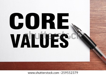Core Values text is on white paper with black pen aside.