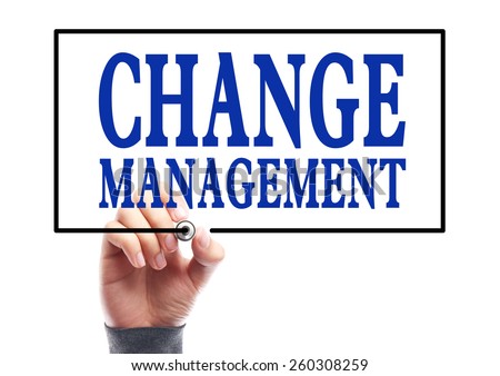 Businessman is writing Change management concept on transparent white board.