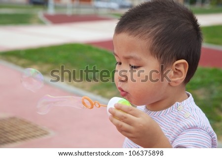 A boy making soap bubbles