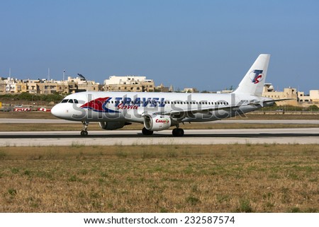 Luqa, Malta June 6, 2009: Travel Service (SmartLynx Airlines) Airbus A320-211 take off from runway 31.