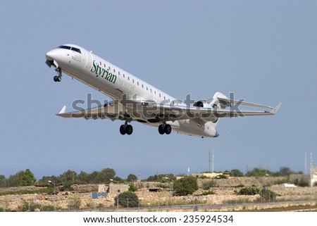 Luqa, Malta August 13, 2005: Styrian Spirit Bombardier CRJ-702 (CL-600-2C10) taking off from runway 32.