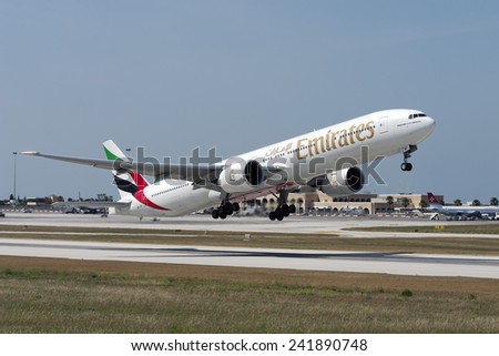 Luqa, Malta June 16, 2007: Emirates Boeing 777-31H/ER takes off from runway 14.