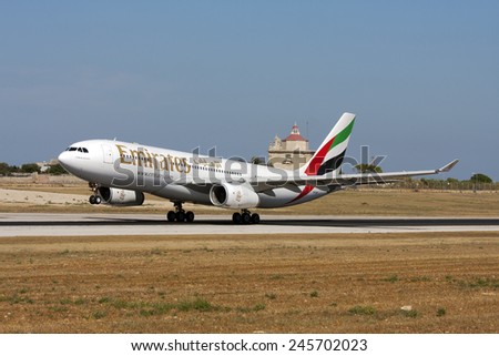 Luqa, Malta July 6, 2009: Emirates Airbus A330-243 lifts off from runway 32.