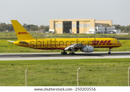 Luqa, Malta February 5, 2015: DHL (European Air Transport - EAT) Boeing 757-236(SF) landing runway 31 on its daily cargo flight to Malta.
