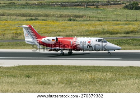 Luqa, Malta April 18, 2015: FAI - Flight Ambulance International Gates Learjet 55 landing runway 31.