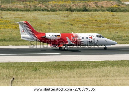 Luqa, Malta April 18, 2015: FAI - Flight Ambulance International Gates Learjet 55 landing runway 31.