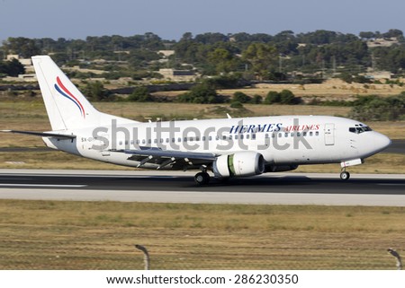 Luqa, Malta June 11, 2015: Hermes Airlines Boeing 737-5L9 landing runway 31, operating for Air Mediterranee.