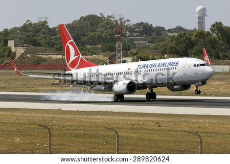 Luqa, Malta June 23, 2015: Turkish Airlines Boeing 737-8F2 landing runway 31 arriving from Istanbul.