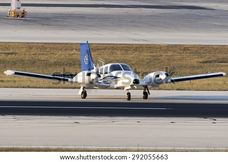 Luqa, Malta June 29, 2015: European Flight Academy Piper PA-34-200T Seneca II making a 180 degrees turn on the runway after landing 13.