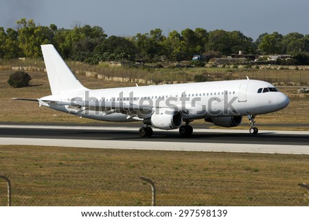 Luqa, Malta July 18, 2015: SmartLynx Airlines Airbus A320-211 landing runway 31, operating for Ryanair.