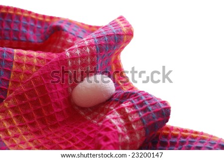 Silk cocoon laying on magenta cloth. For other similar images from the series, please, check my portfolio.