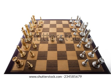 Two pawns face off against each other at the start of a chess match.