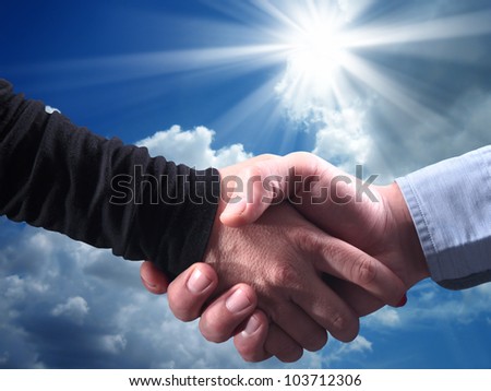 close up shot of handshake of a woman and a man