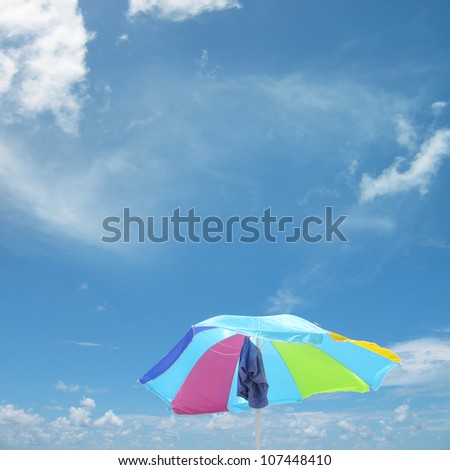 close up shot of beach umbrella over clear sky