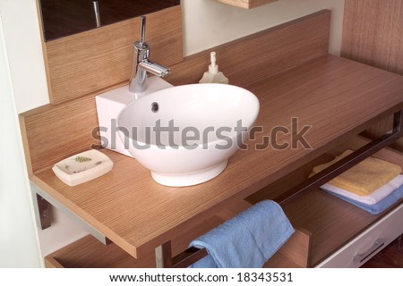 detail shot of bathroom sink and mirror from a house