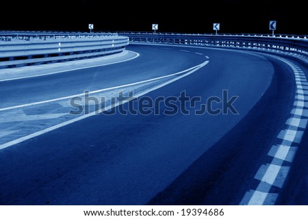 close up shot of road curve at night