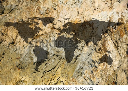conceptual image of rock with flat world map
