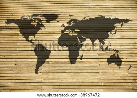 conceptual image of flat world map on wooden background