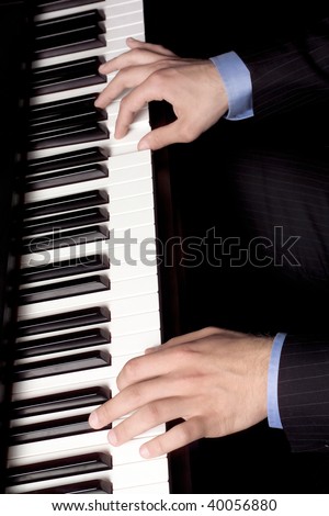 an elevated view of a man playing piano