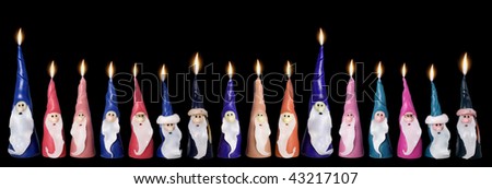 Christmas, several Santa Clause candles in a row