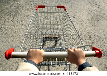 an elevated view of a single empty shopping-cart