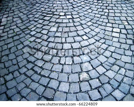 close up shot of a cobblestone alley in winter time